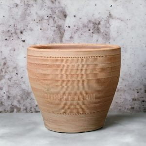 Range of Terracotta Pots 47 A rustic clay pot on floor.