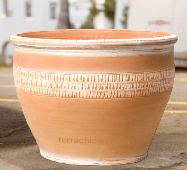 large terracotta planter on road