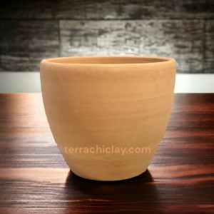 Range of Terracotta Pots 50 Egg Planter Plain on dark wooden floor