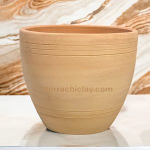 Range of Terracotta Pots 43 Clay planter on marble counter.