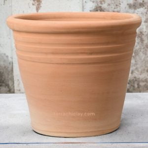 clay planter of conical shape on concrete floor