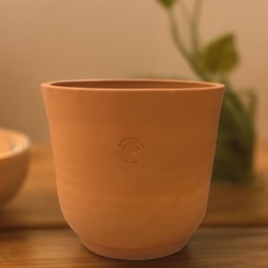 Range of Terracotta Pots 10 cup shaped small clay pot on wooden table
