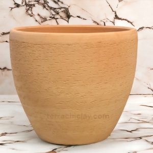 Range of Terracotta Pots 41 egg planter sesame on creamy marble floor