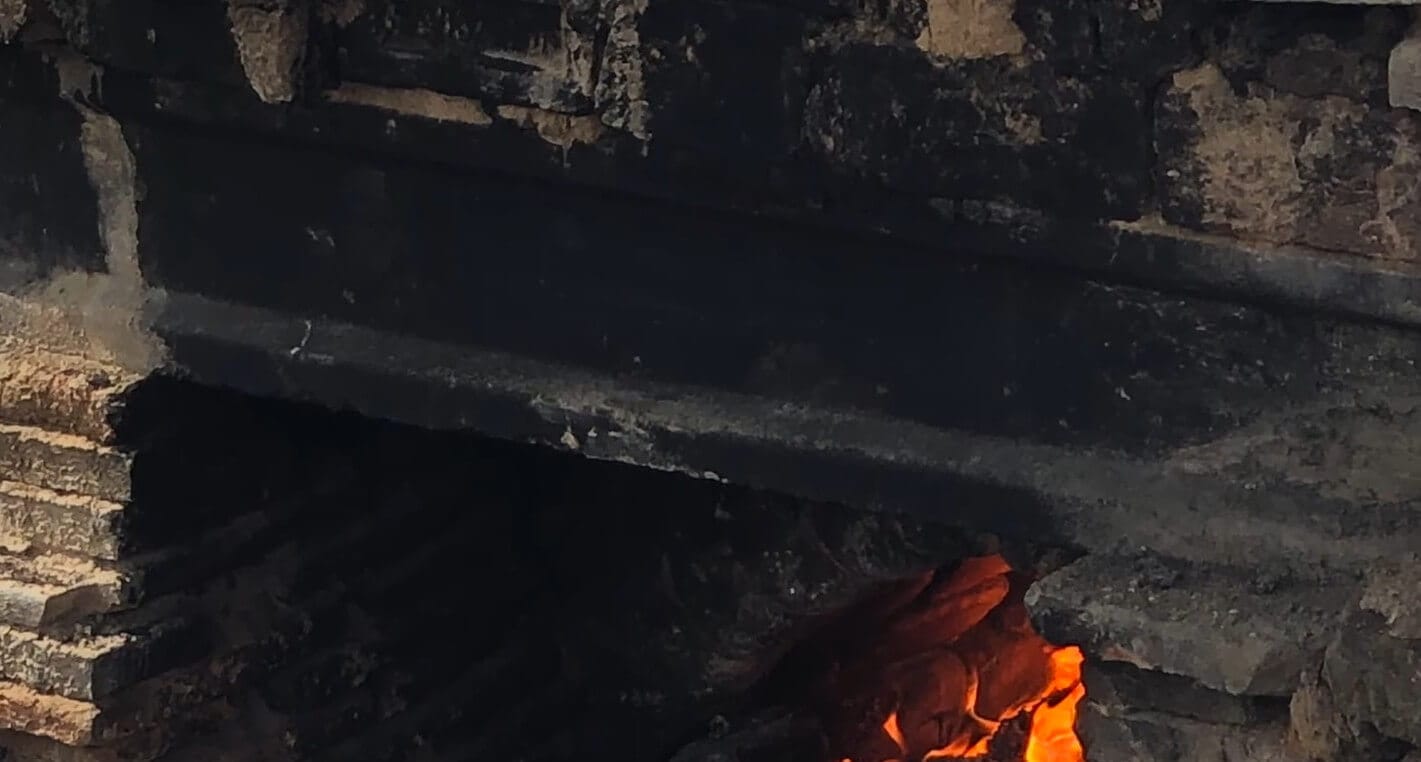 Handmade terracotta pots carefully loaded inside the beehive kiln before firing