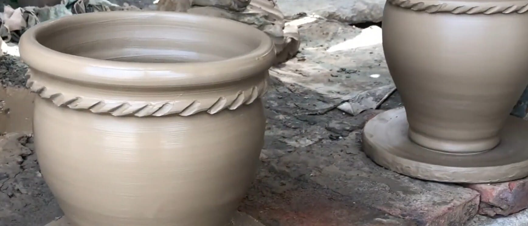 Completed handmade terracotta pot showcasing quality throwing rings and natural color variation